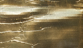 A sleek golden metallic texture blending with modern architectural lines and subtle circuit patterns.