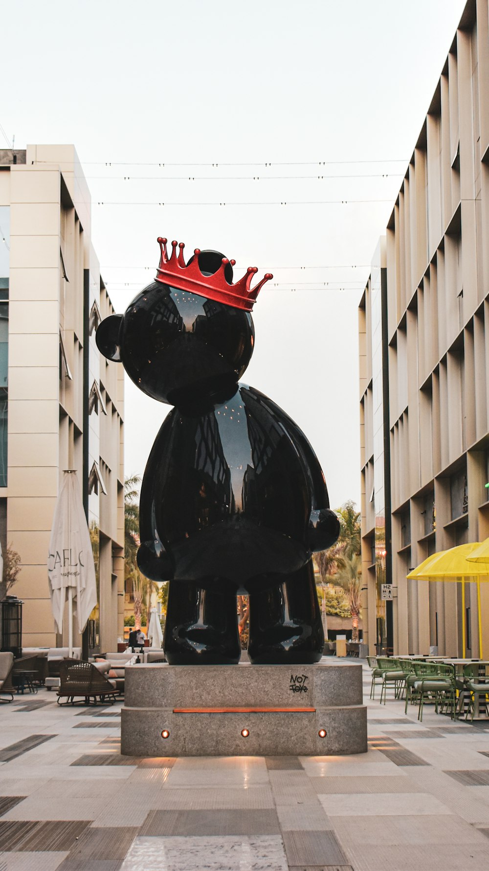 a statue of a bear with a crown on its head