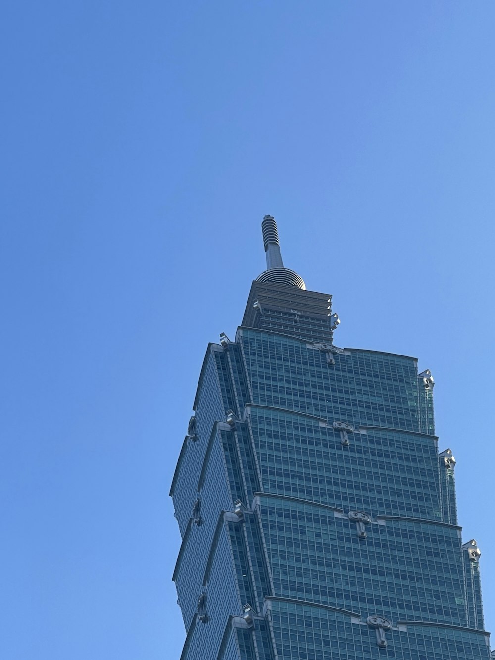 a very tall building with a clock on it's side