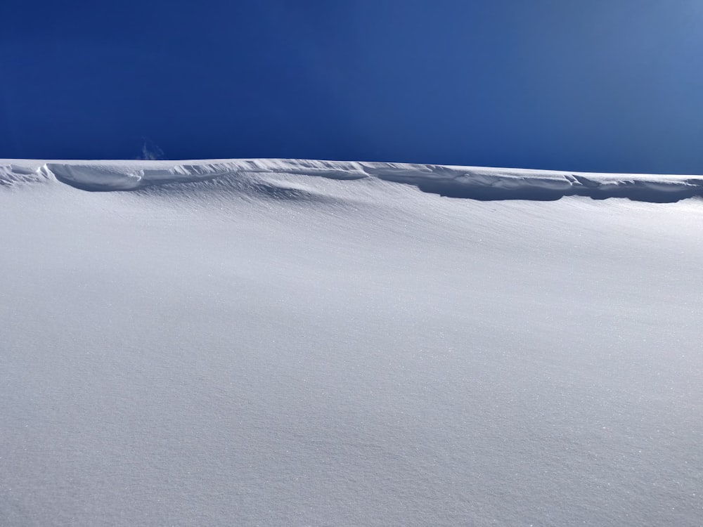 a person skiing down a snow covered slope