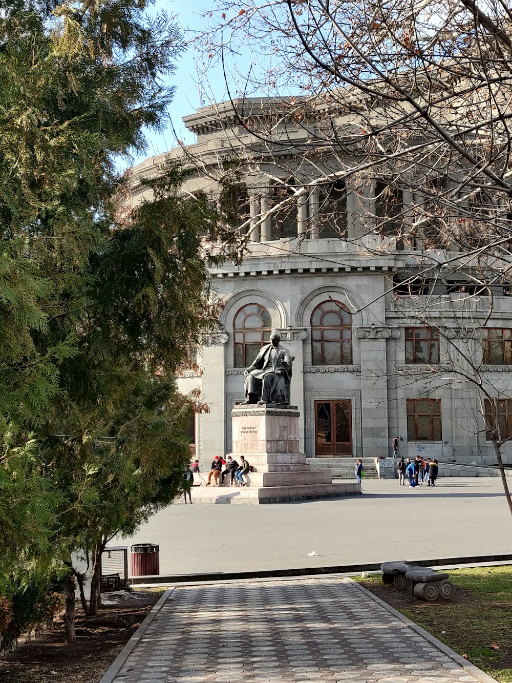 a large building with a statue in front of it