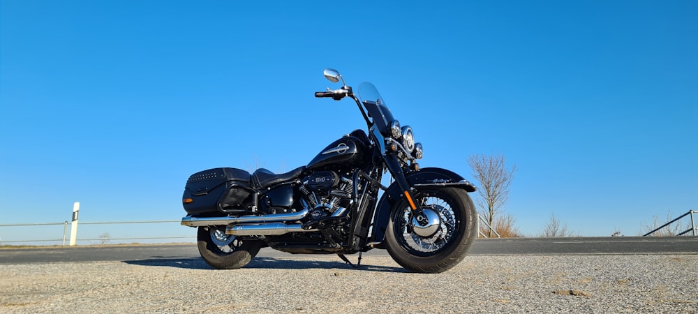 a black motorcycle parked on the side of the road