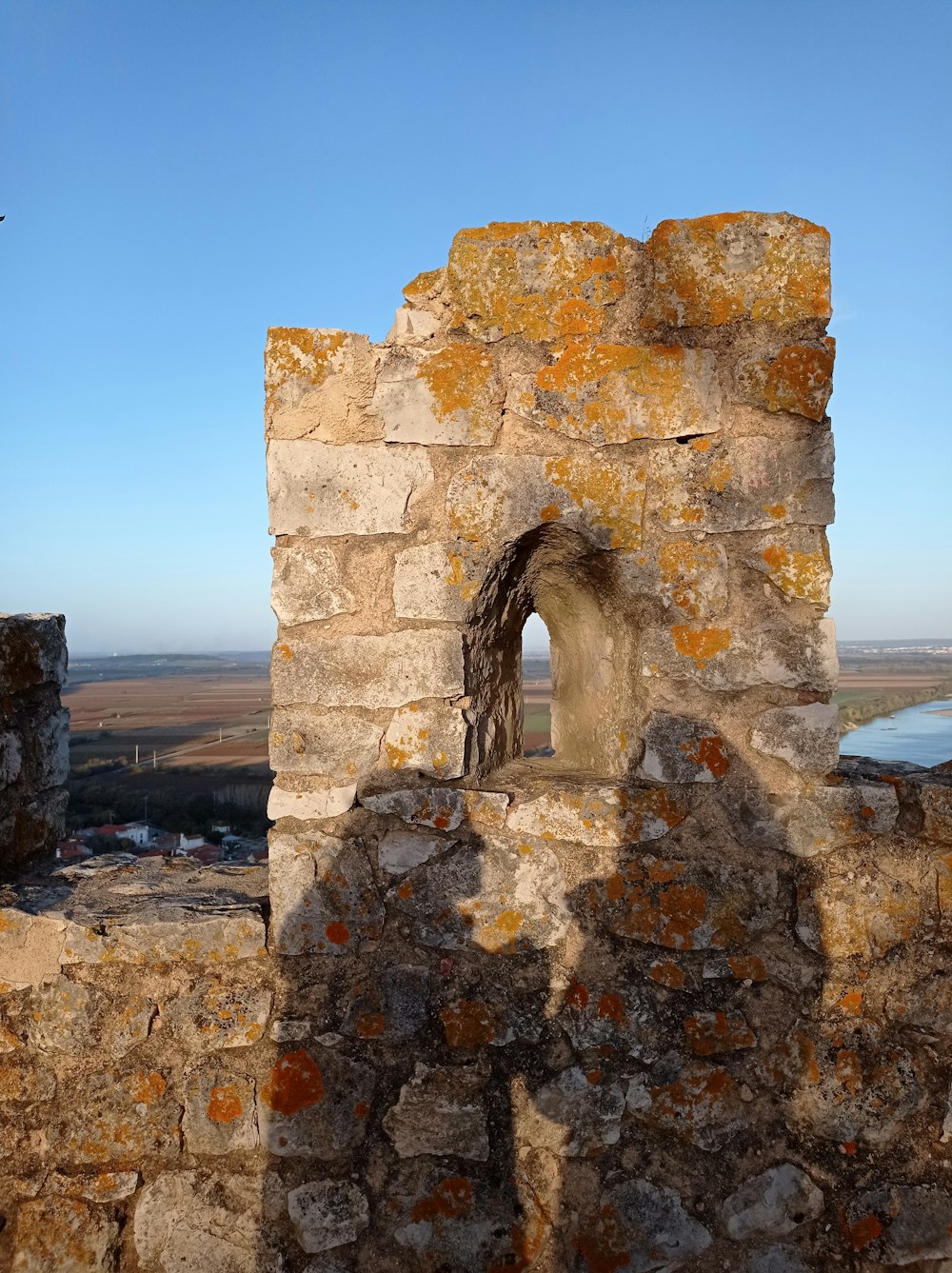 a stone wall with a hole in the middle of it