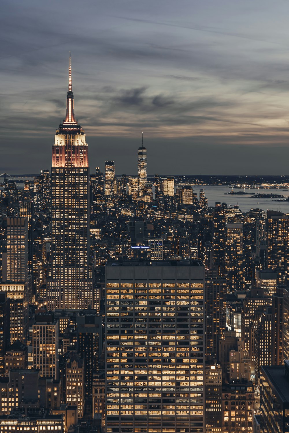 a view of a city at night from the top of a building