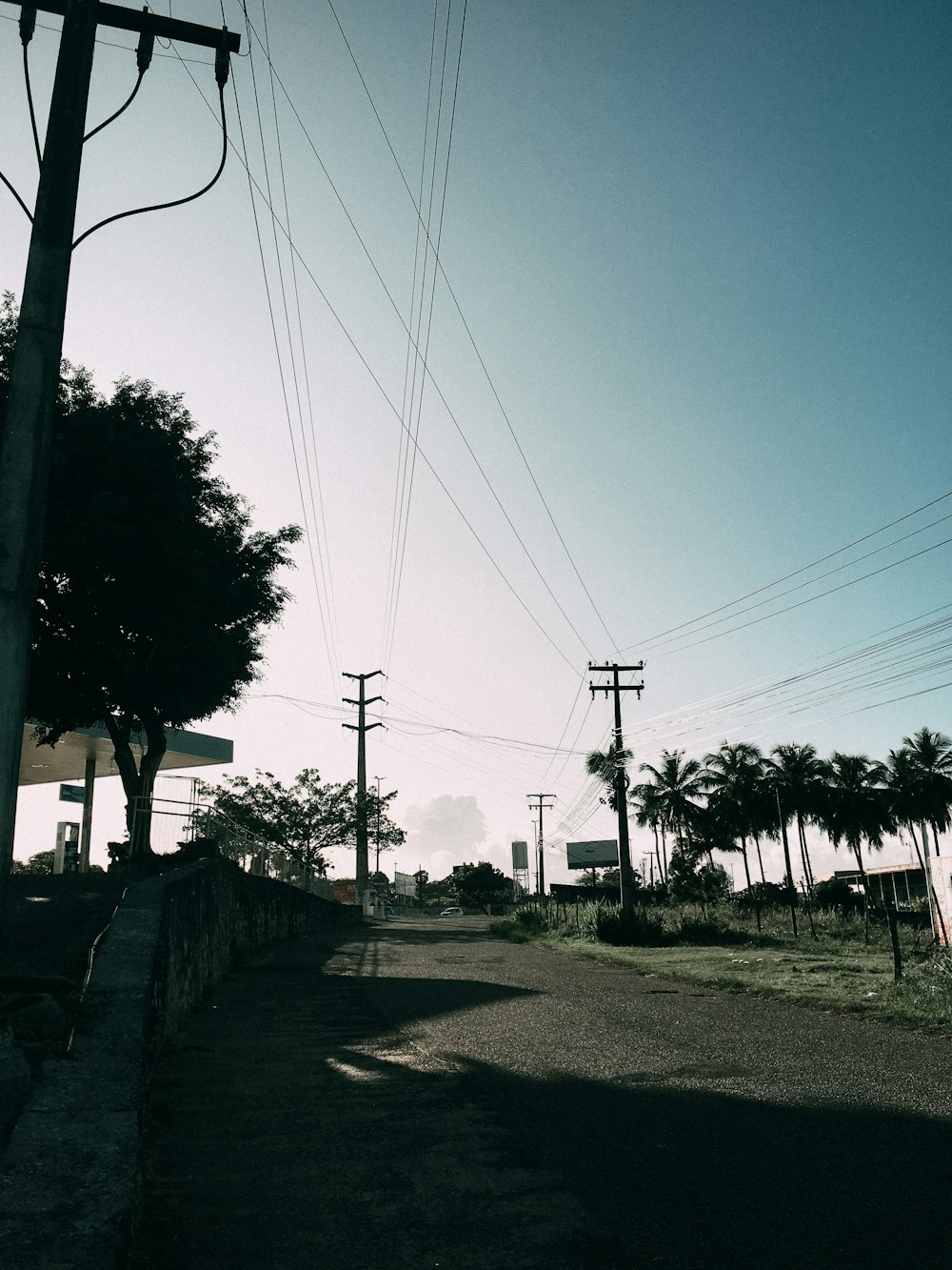 a street with power lines and telephone poles