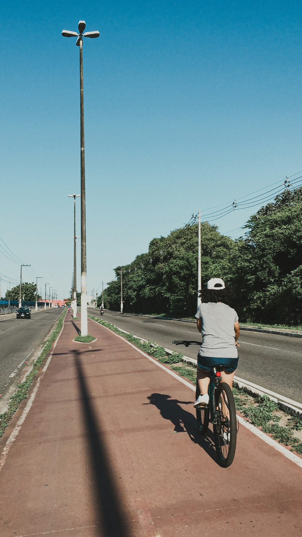 a person riding a bike down a street