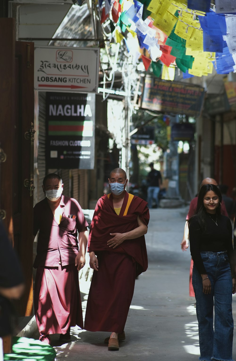 a group of people walking down a street