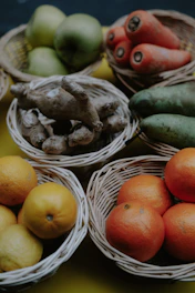 Close-up of fresh organic fruits arranged in a rustic basket.