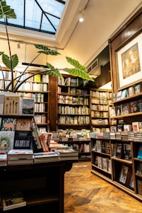 A warm, inviting bookstore interior with wooden shelves filled with colorful books and a small reading nook bathed in natural light.