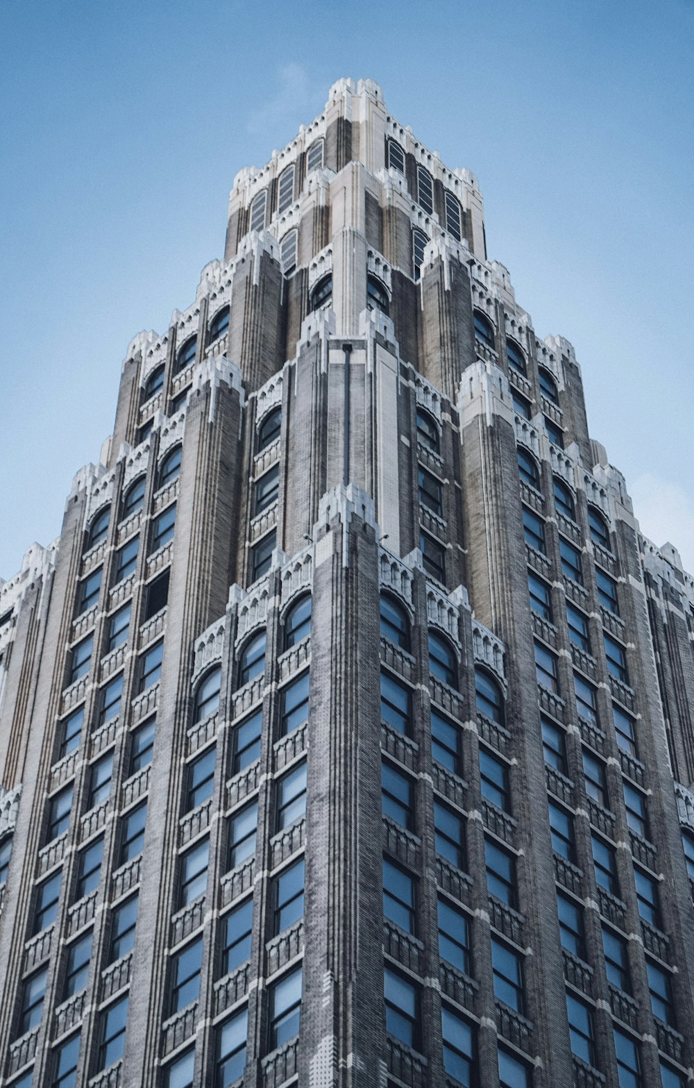 a very tall building with many windows on top of it