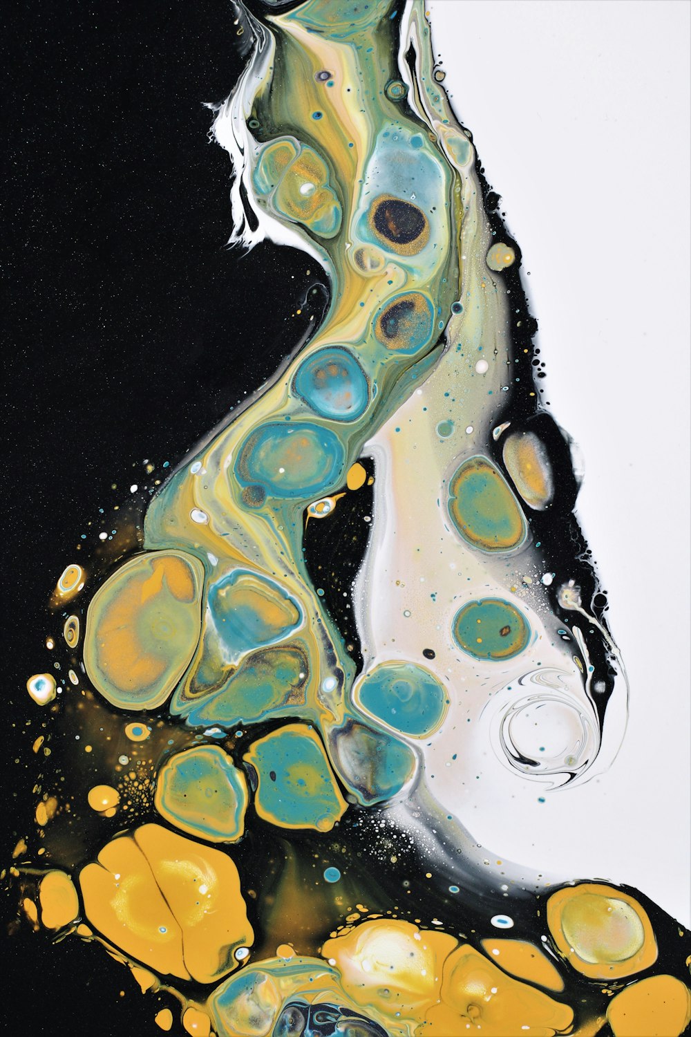 an abstract painting of yellow and blue bubbles