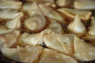A close-up of a frying machine with food being cooked.