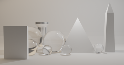 A minimalist arrangement of geometric shapes including a rectangular prism, multiple transparent spheres, a pyramid, and a tall cylinder. The objects are in neutral colors and are evenly spaced in a soft, well-lit environment.