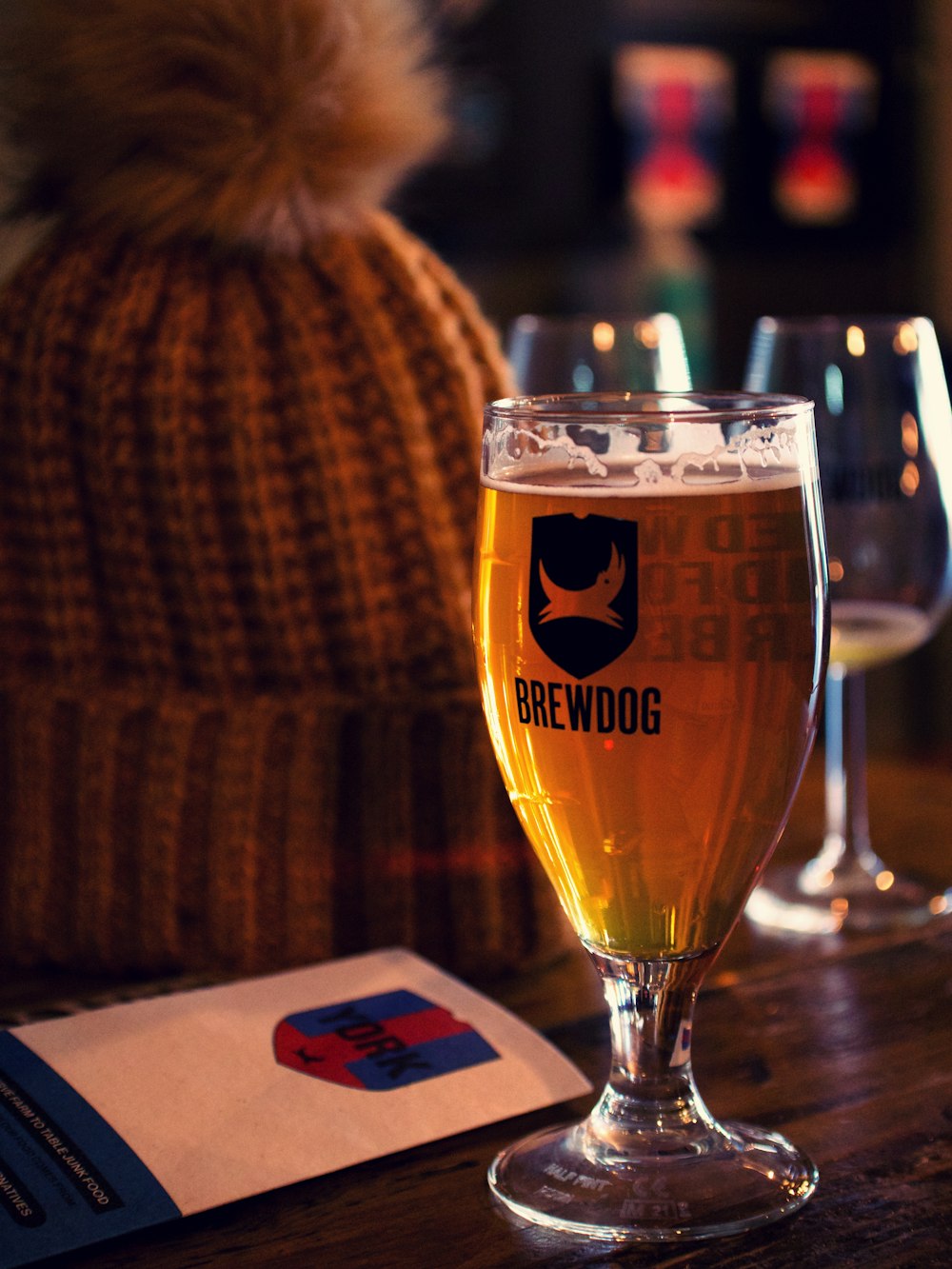 three glasses of beer are sitting on a table