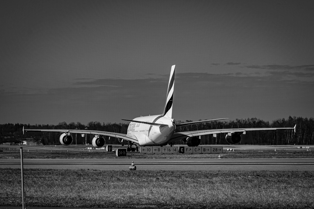 a large jetliner sitting on top of an airport runway, A380 at zurich airport (ZRH)