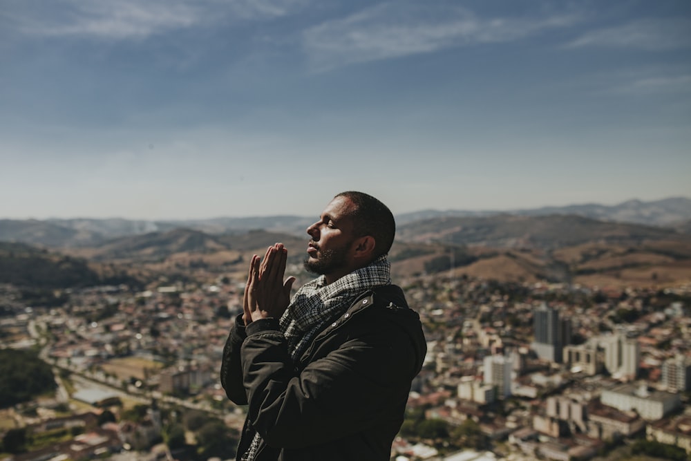 a man standing in front of a city