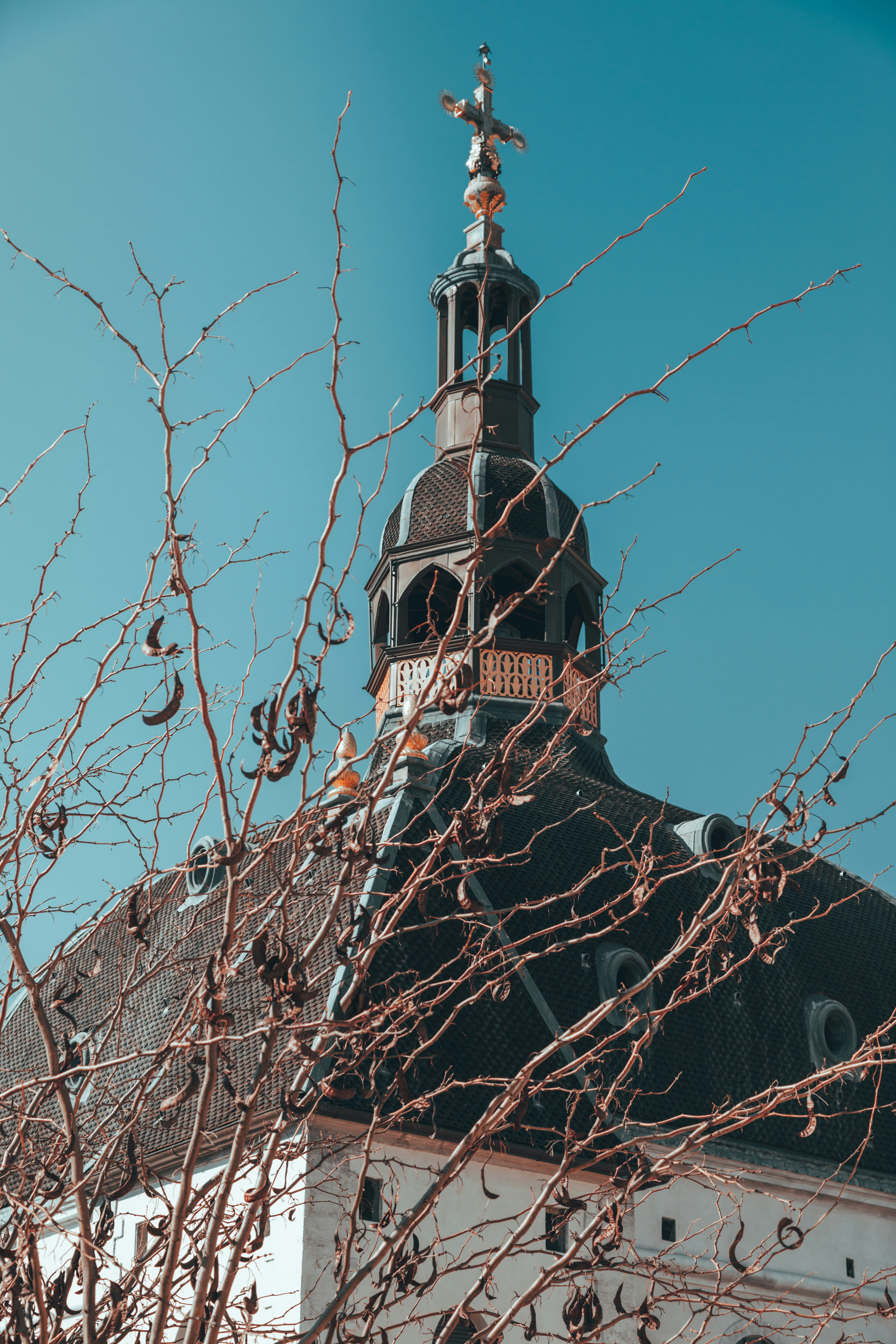 A tall building with a clock on the top of it photo – Free Lyon Image ...