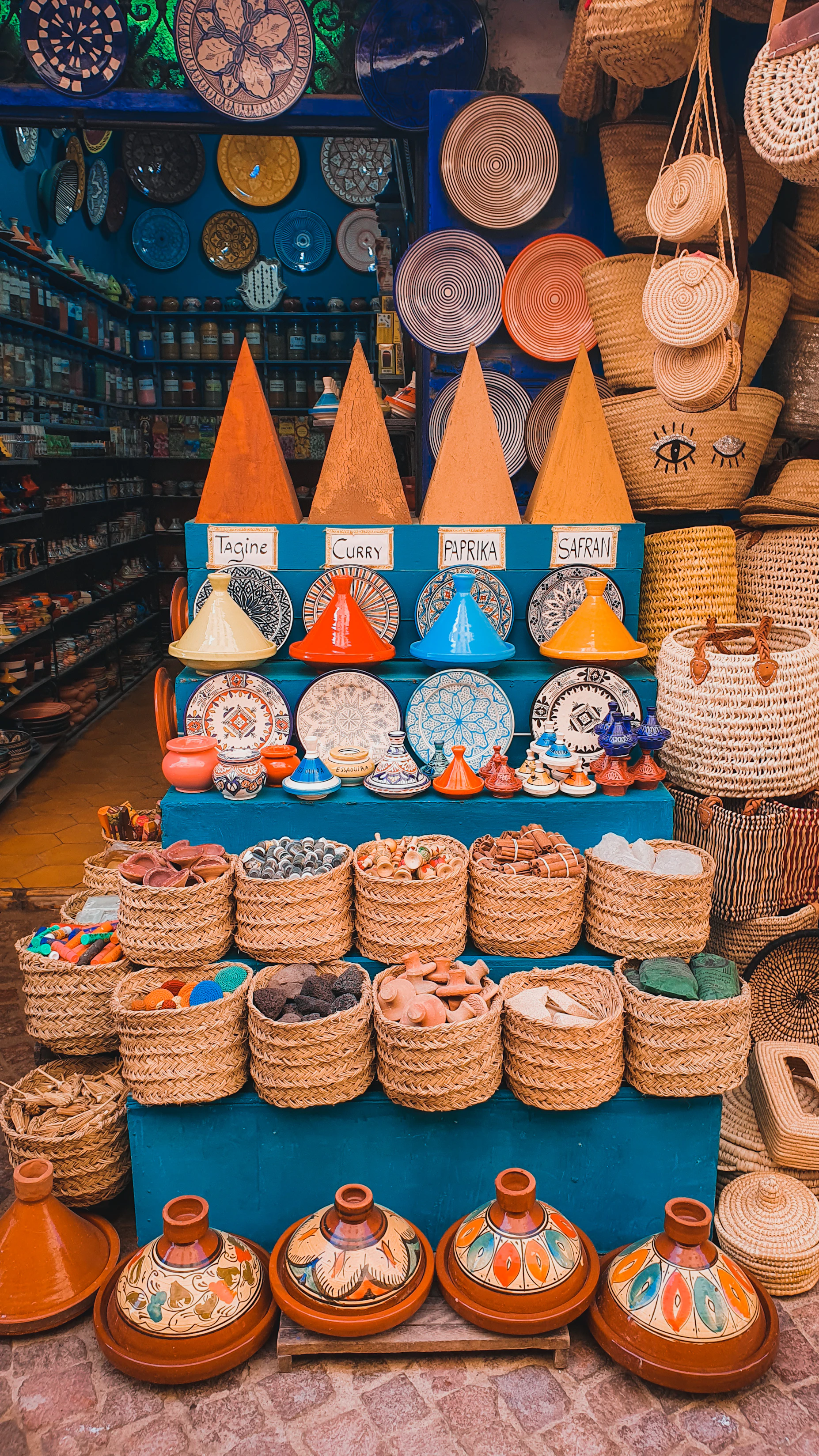 Spices and textiles inside a relaxed Moroccan market