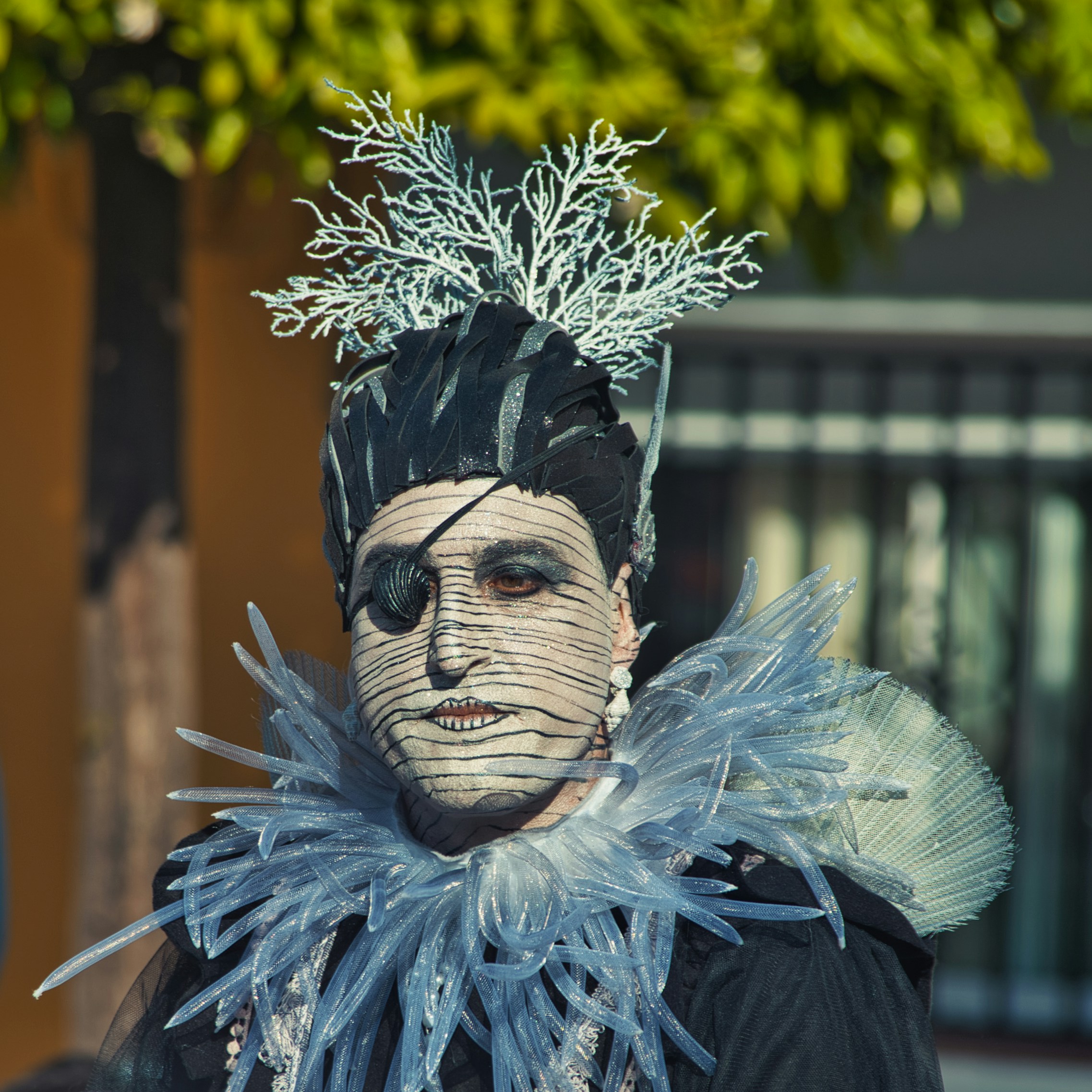 man in feathered headdress and costume