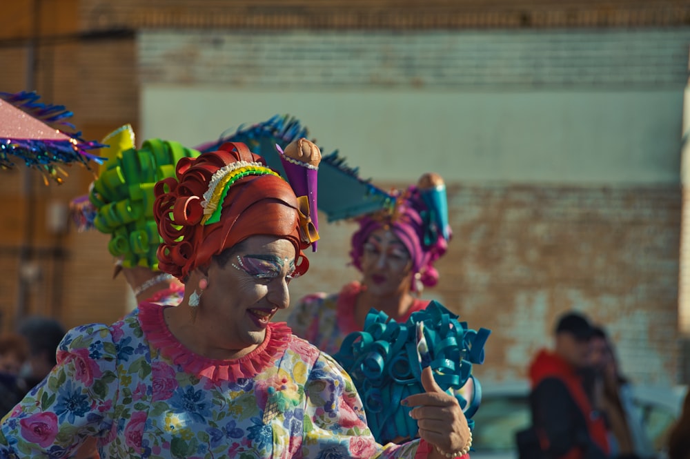 a group of women in colorful costumes dancing