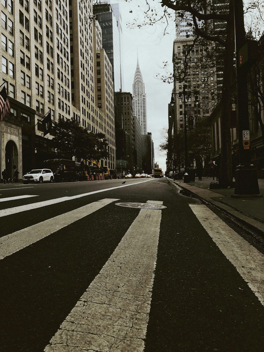 a city street with tall buildings on both sides