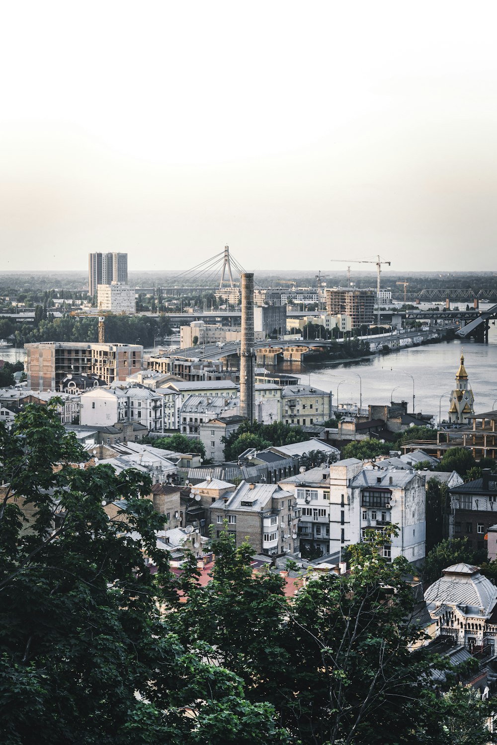 a view of a city with a bridge in the background