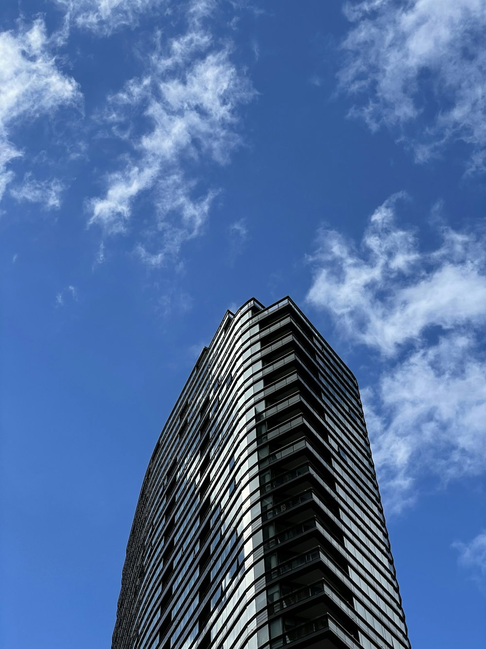 a tall building with a sky background