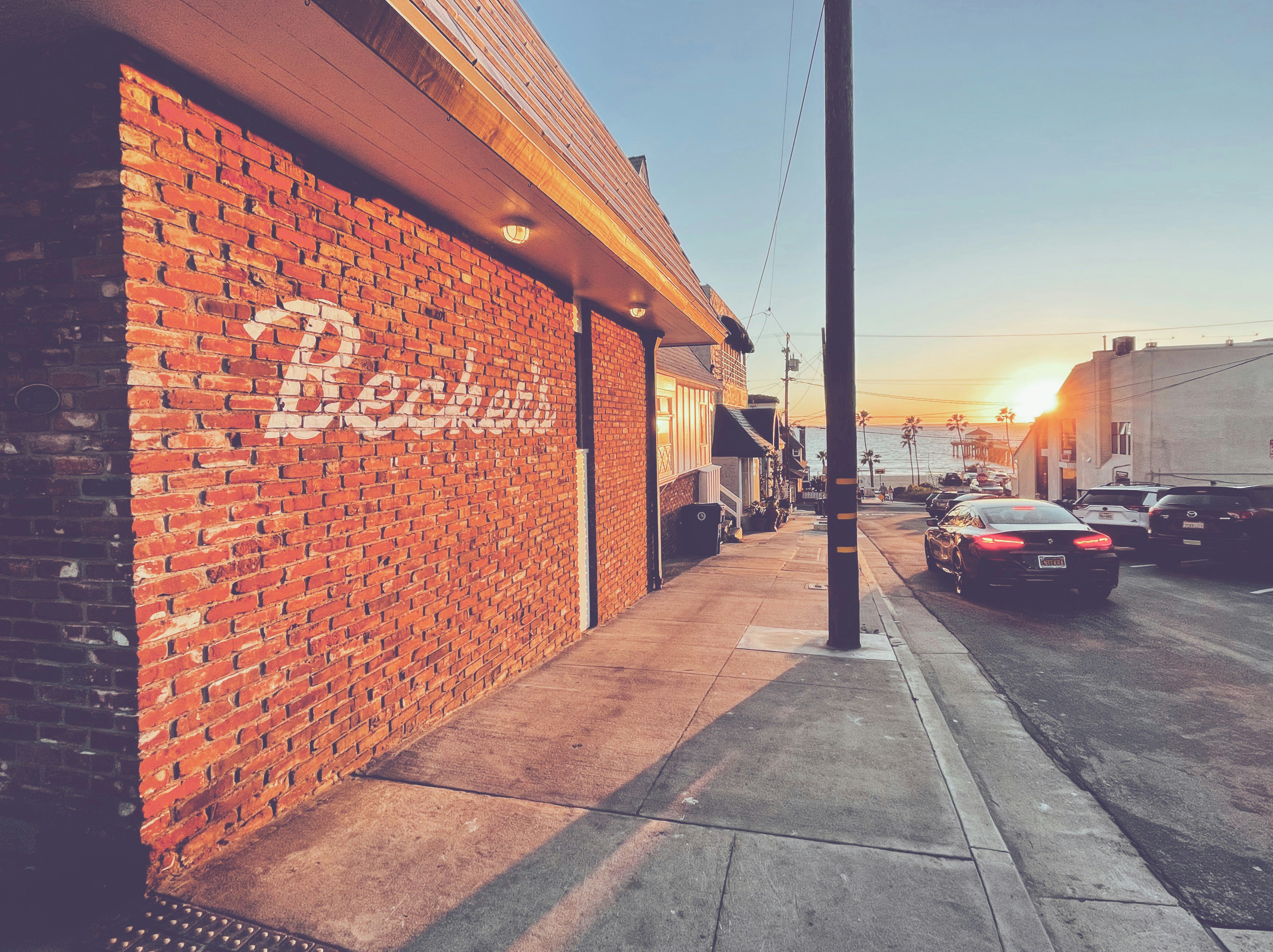 a brick building with a sign on the side of it