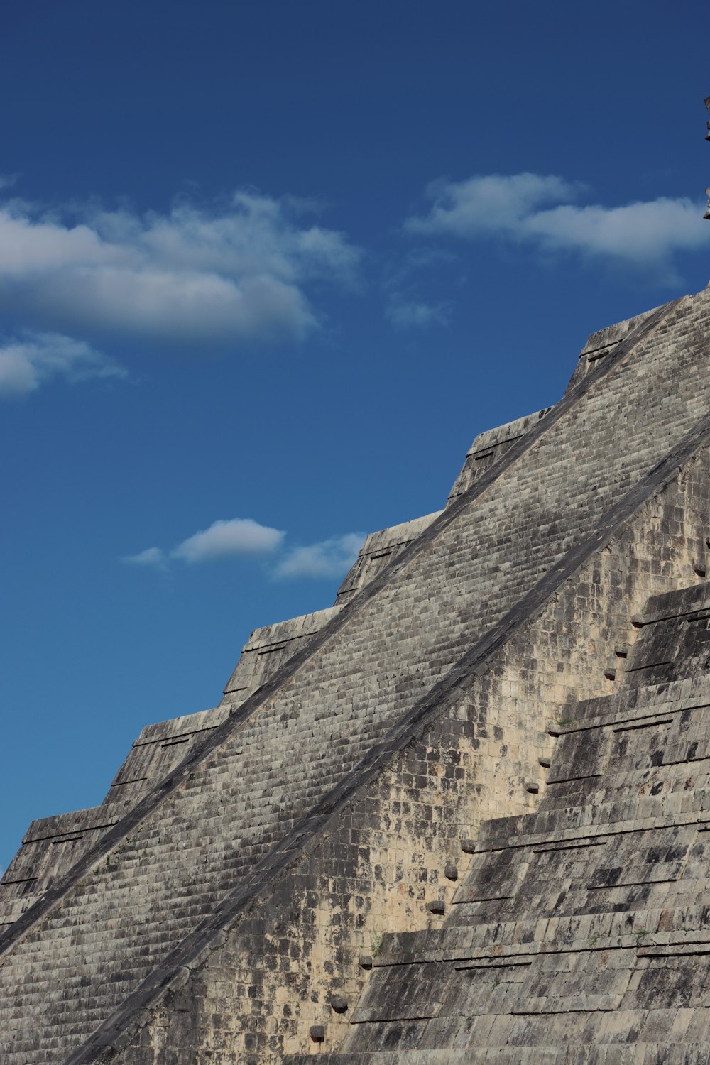 a large pyramid with a clock on top of it