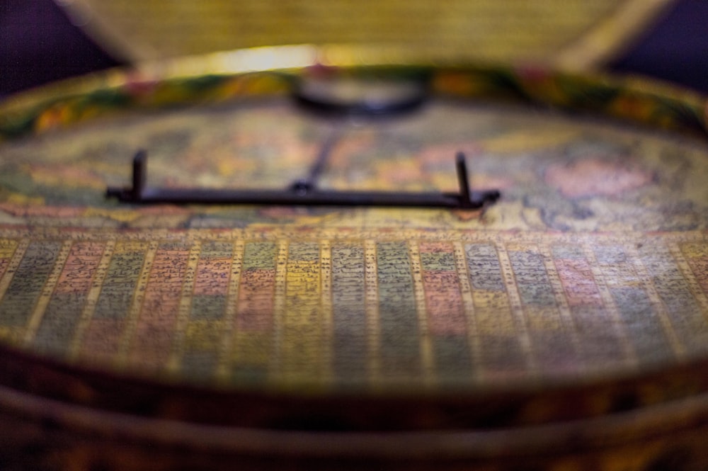 a close up of a wooden box with a metal handle