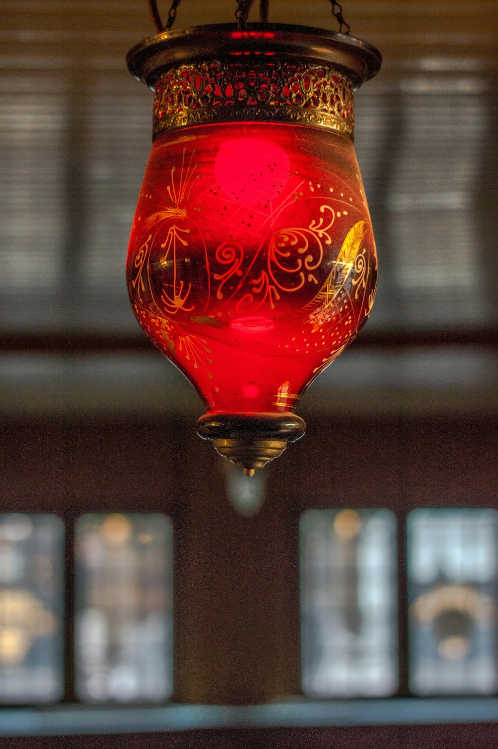 a red light hanging from a ceiling in a room