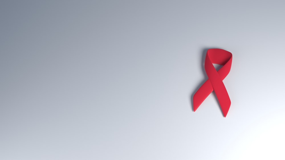 a red ribbon on a white background