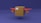 A cardboard box is designed to resemble an airplane, featuring red wings and propellers on either side. The background is a deep blue shade, contrasting with the brown box and red elements.