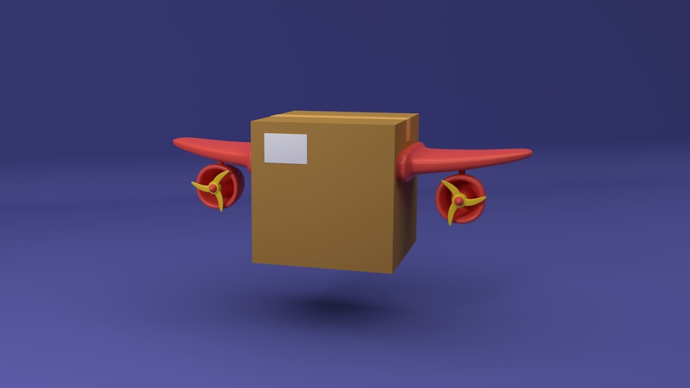 una caja de cartón con una hélice roja