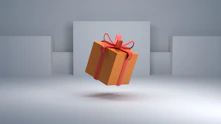 an orange gift box with a red bow
