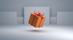 an orange gift box with a red bow