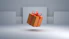 an orange gift box with a red bow