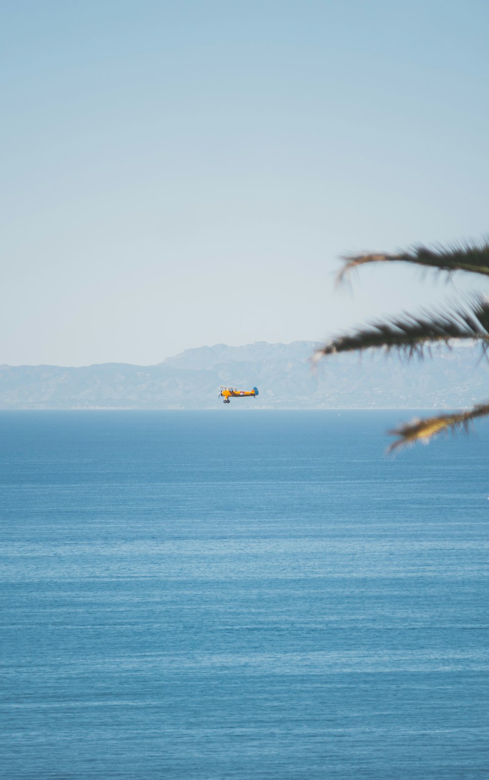 a plane flying over a body of water