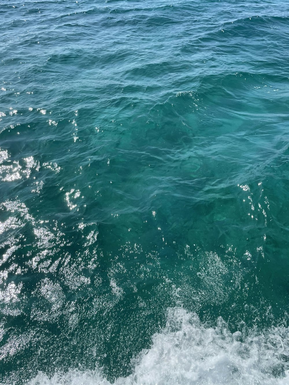 a person riding a surf board on a body of water