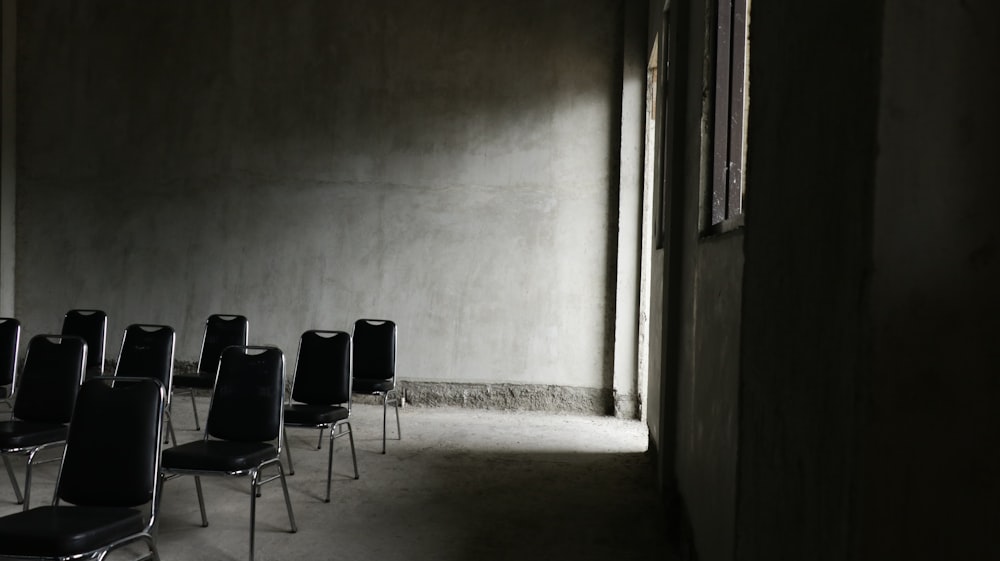 a row of chairs in a dark room