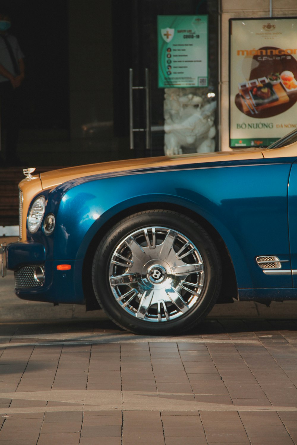 a blue car parked on the side of the road