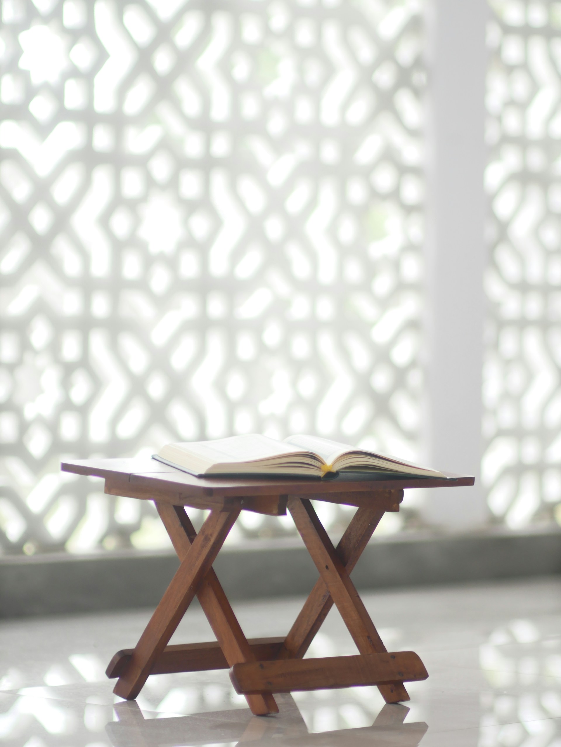 a wooden table with a book on top of it
