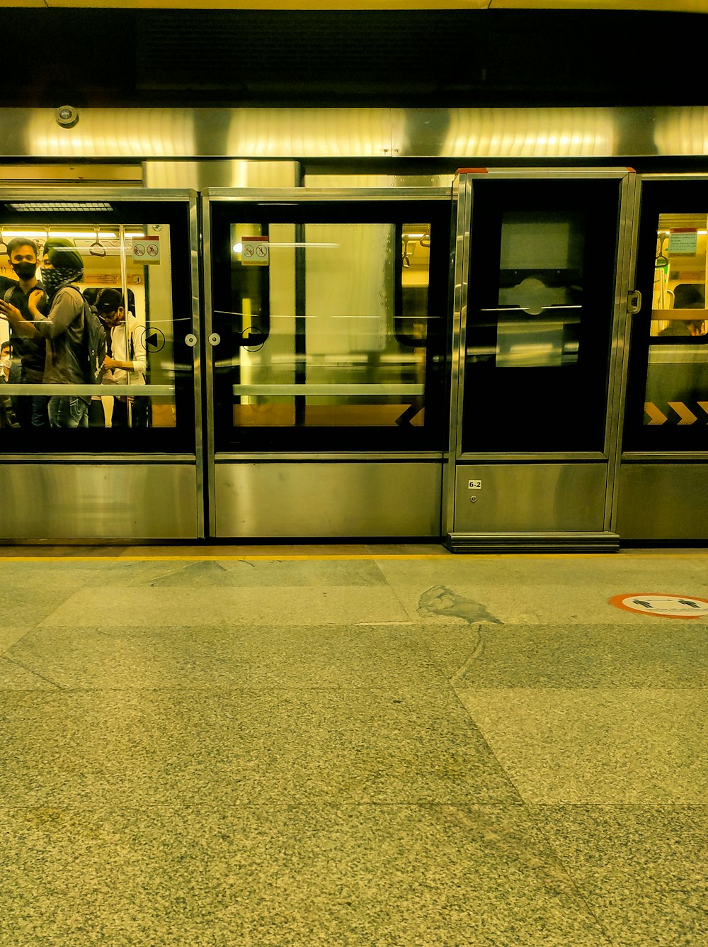 a subway station with people waiting for the train