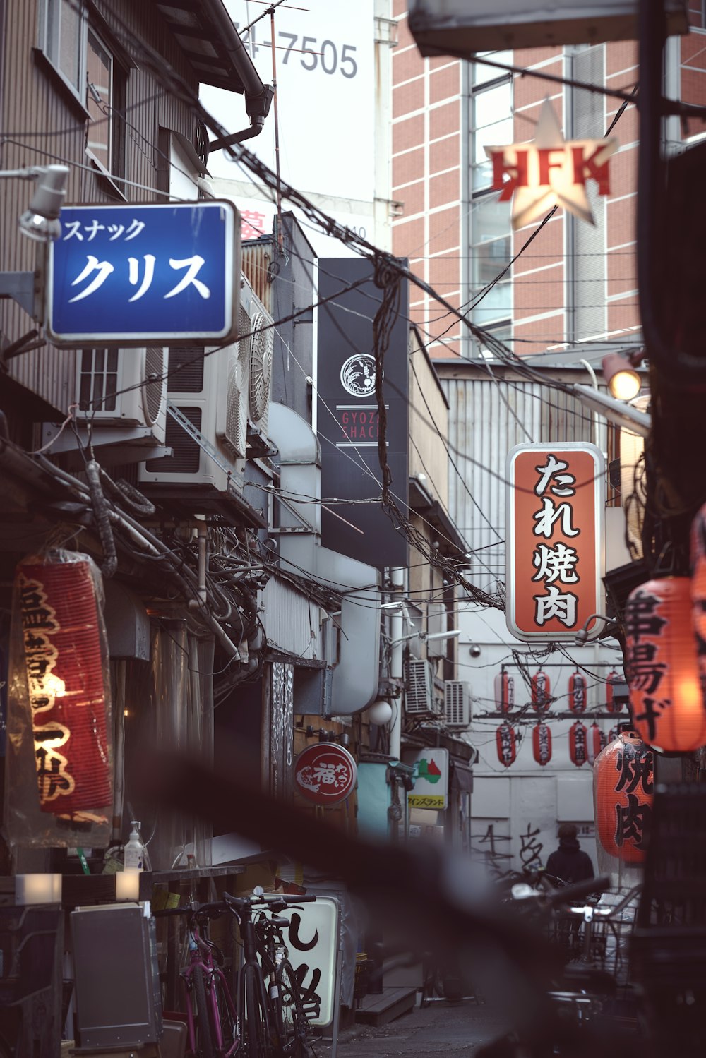 a city street filled with lots of tall buildings