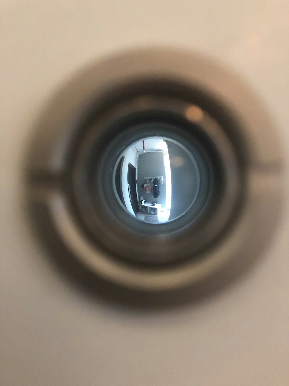 a close up of a toilet bowl with a reflection of a person in it