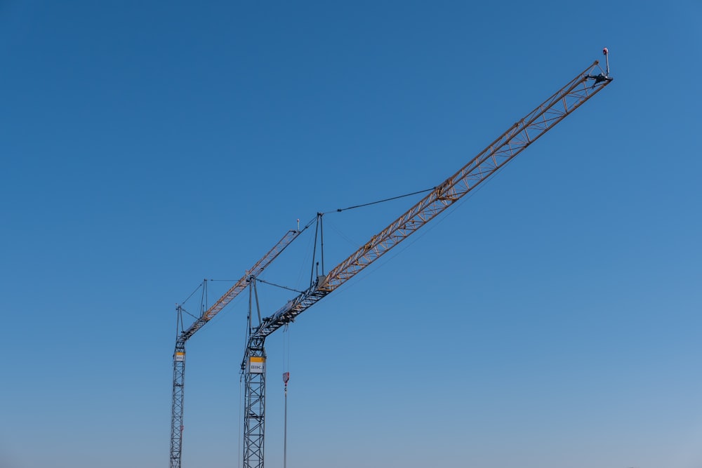 a large crane sitting on top of a sandy beach