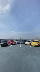 a group of cars parked in a parking lot