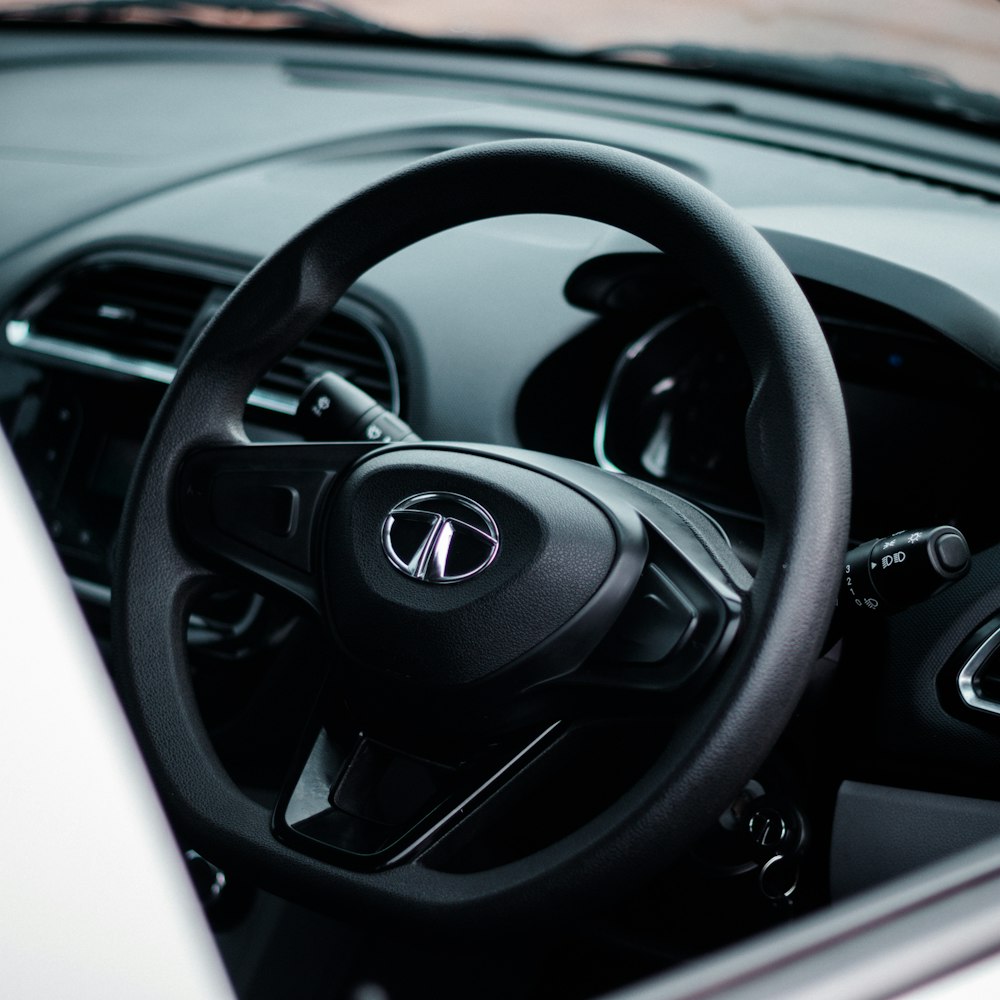 a close up of a steering wheel and dashboard of a car