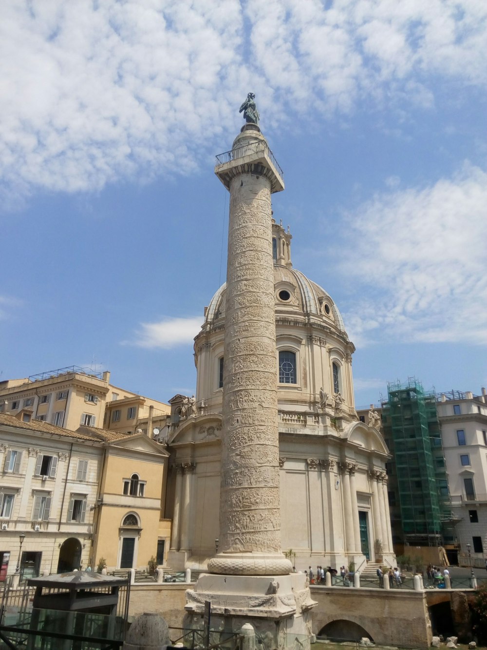 a tall white tower with a clock on top of it