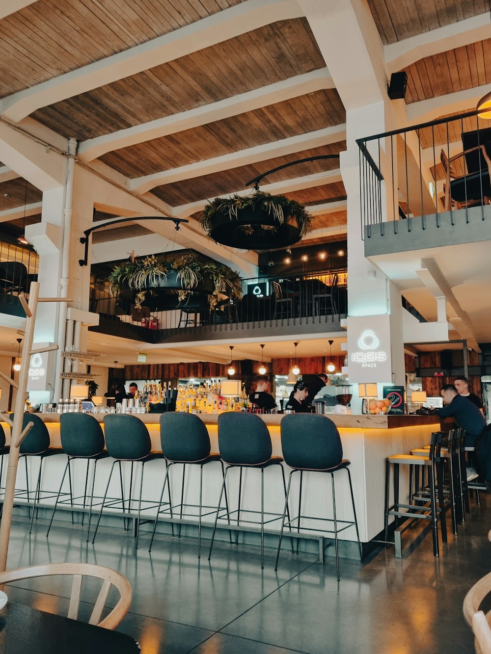 a restaurant with a bar and several chairs